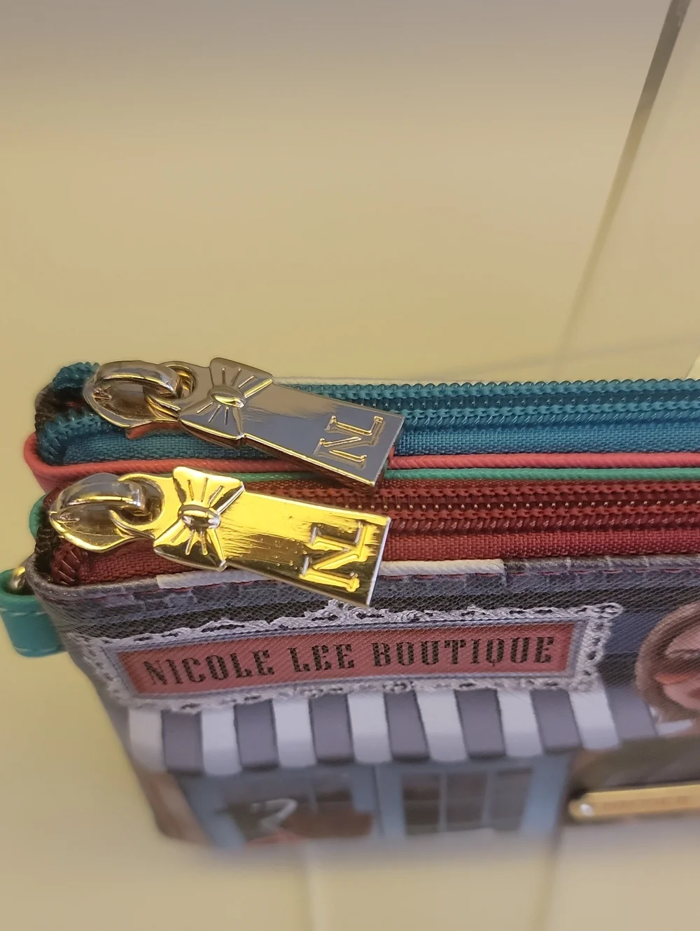 Nicole Lee Turquoise Multi-Panel Printed Wristlet